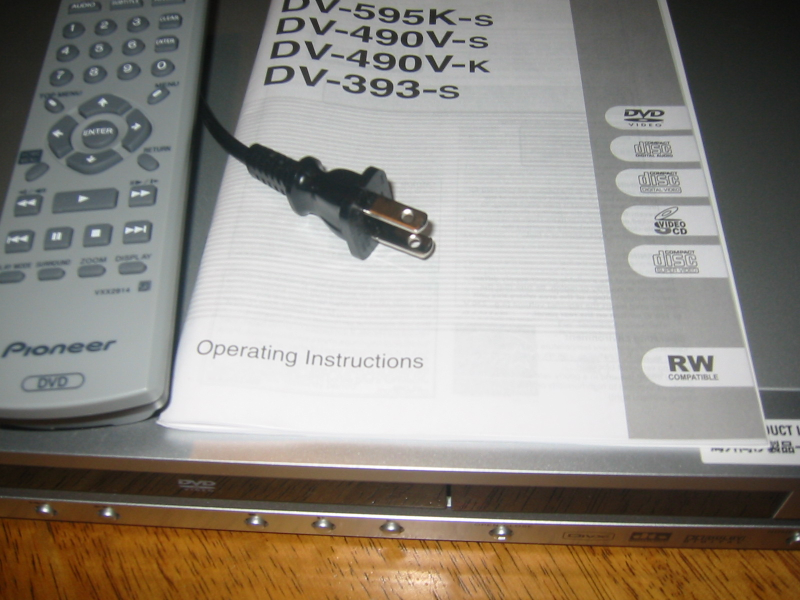Some "region-free" DVD players can play DVDs from any part of the world, output an NTSC video signal, and accept North American 110V/60Hz current. This one even has a North American plug. Picture of a "region-free" Pioneer DV-393-s DVD player, which is able to play DVDs having any region code and is compatible with typical North American video equipment. This one even has a North American plug.